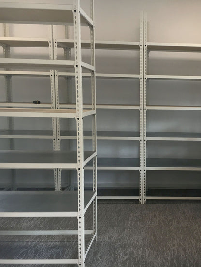 Installed Speedrax medium duty shelving system, with metal shelving decks